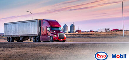 Image with a red cargo truck and Esso and Mobil logo